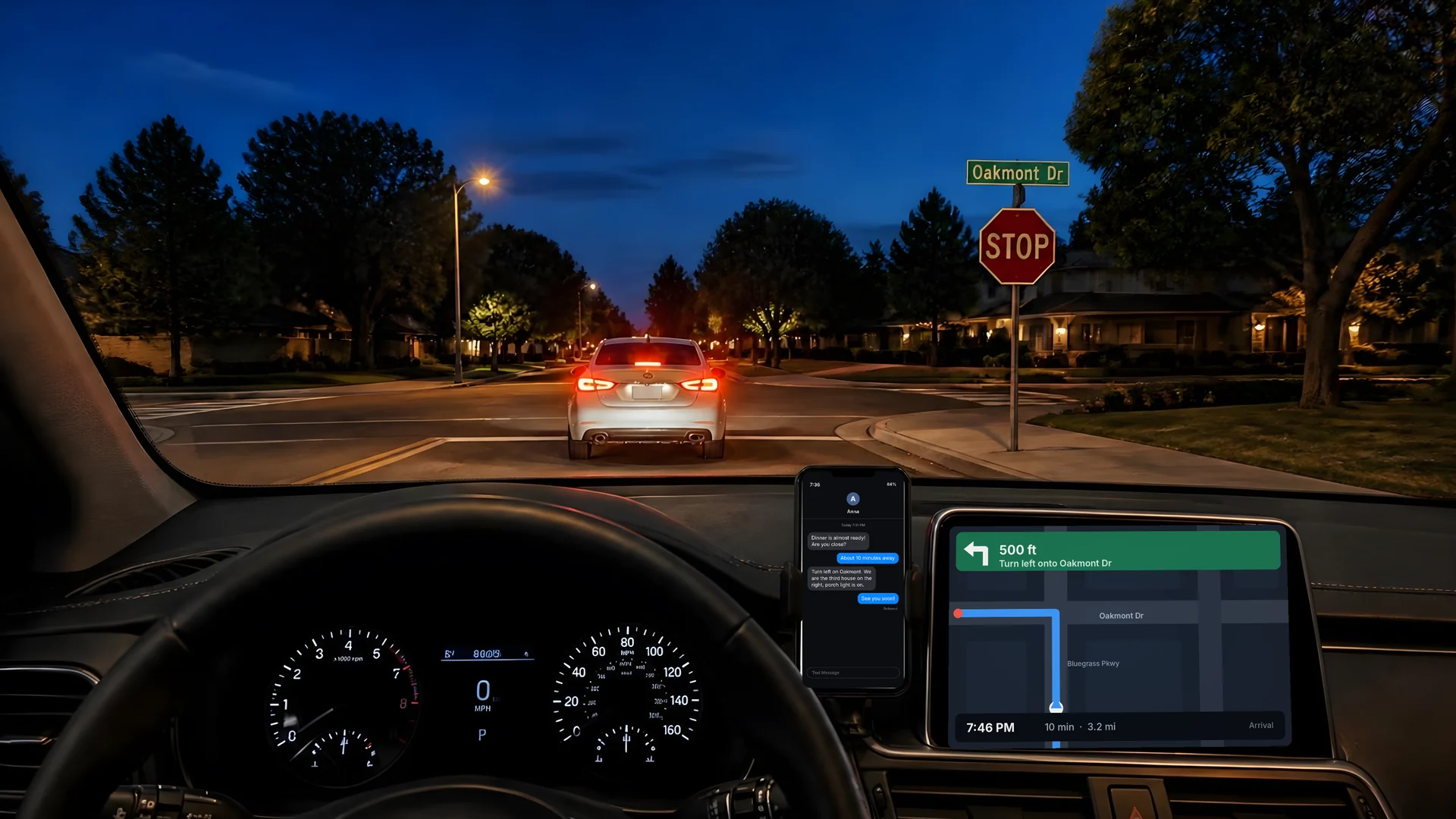 Driving at dusk seen through the selected lens: a stop sign and tail lights ahead, the dashboard navigation screen, and a phone in a dash mount